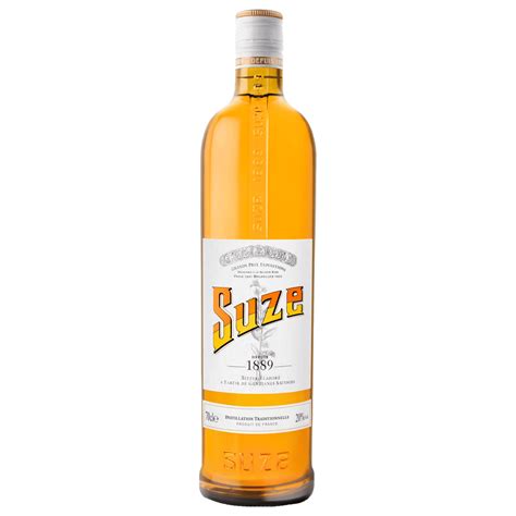 Bottle of Suze French gentian aperitif with its yellow label