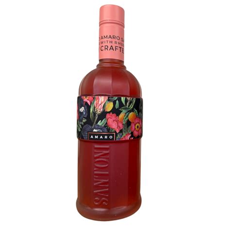 Bottle of Amaro Santoni with its dark floral-print label band and pink cap, filled with ruby-red wine-based amaro