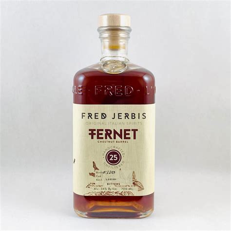 Bottle of Fred Jerbis Fernet 25 with its pale label and wooden cap