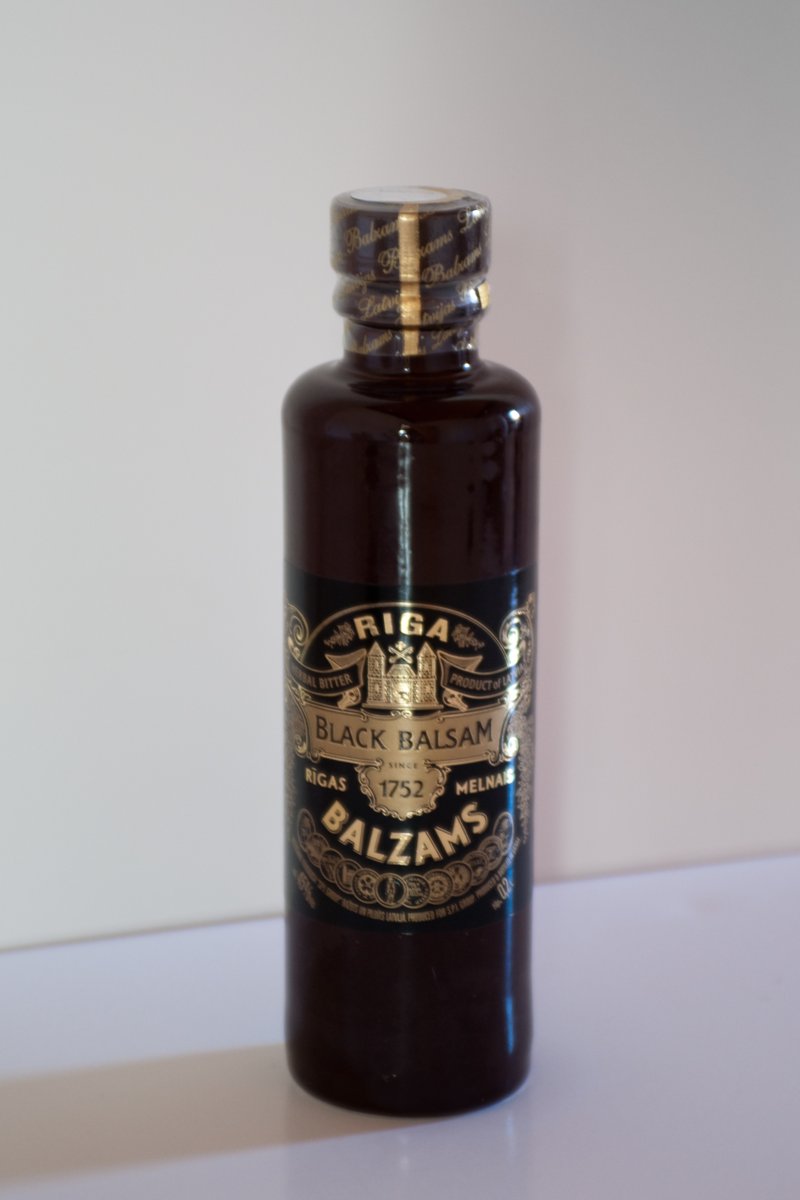Dark ceramic bottle of Riga Black Balsam Latvian herbal bitter with a black and gold label