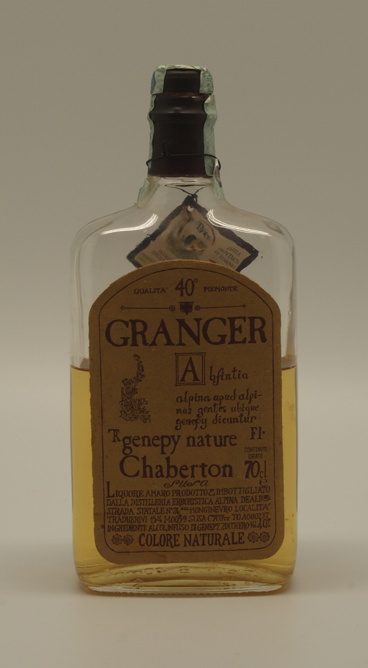 Flask-shaped bottle of alpine genepy liqueur with a vintage label